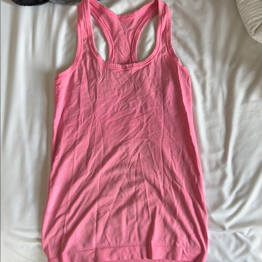 Pink fitted sleeveless tank top with scoop neck